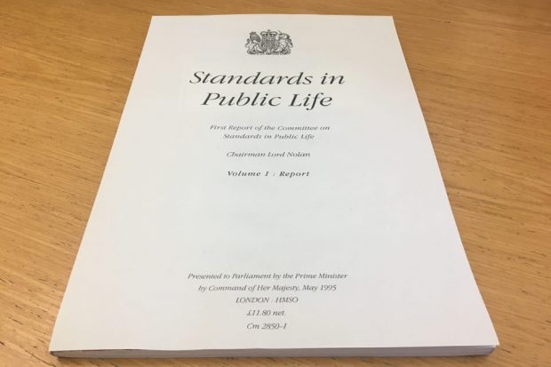 A4 front cover of CSPL's first report, stating: 'Standards in Public Life First Report of the Committee on Standards in Public Life Chairman Lord Nolan COlume 1: Report'